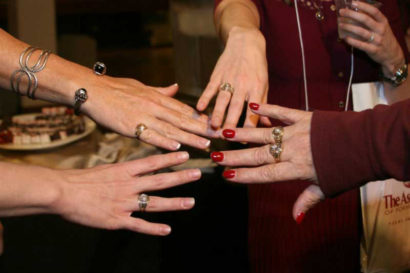 Stock photo of Aggie women's hands with Aggie rings