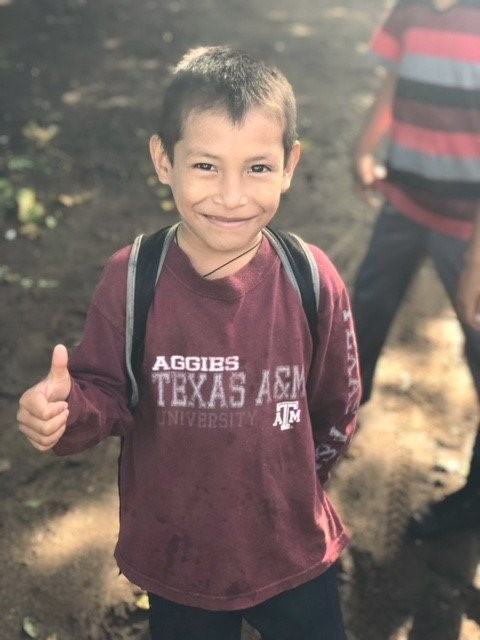 While on the Guatemala trip, students from the Texas A&M System met a child wearing a Texas A&M shirt.