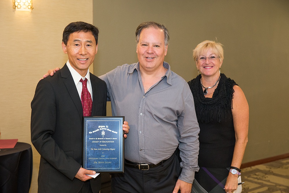 Renyi Zhang (left) and Philip Yasskin (center) received Sigma Xi honors last week.