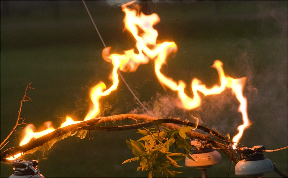 Vegetation on electric lines can cause flashovers such as this one. Flashovers like these often ignite wildfires. (Texas A&M Engineering)
