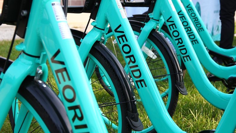 Close-up of teal VeoRide bikes in a row