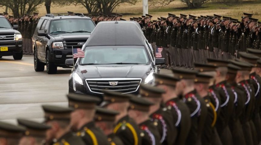 cadets in front of a hearse