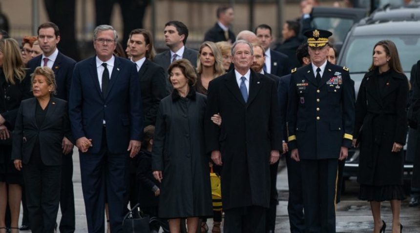 george bush and other members of the bush family stand outside