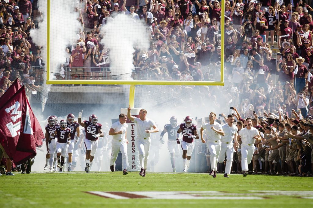 Yell Leaders lead the Aggies onto Kyle Field before kick off against Tennessee in 2016. (Texas A&M Marketing & Communications)